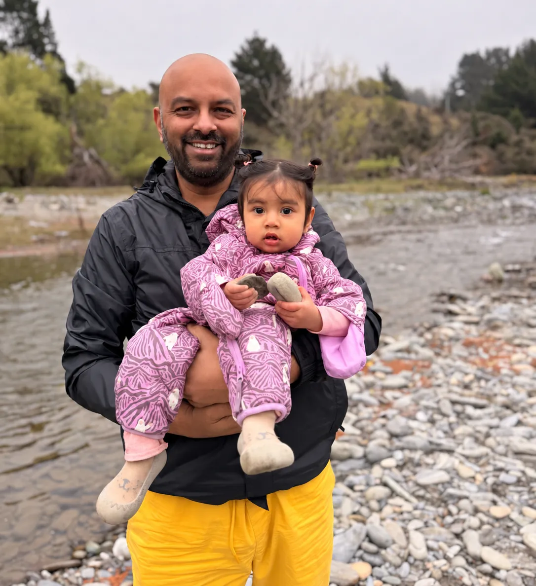 Jeevan Daniel Rajamani with his daughter by a river